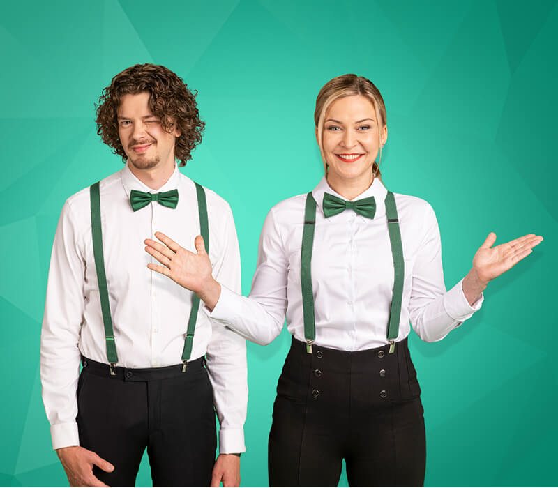 Casinohuone hosts in white shirts and green bow ties